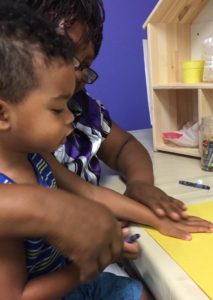 toddler with mom at indoor play center tampa